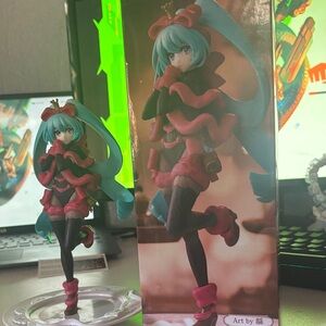 Anime Figure with Blue Hair and Red Outfit